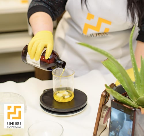 Cosmetic Formulation Academy student measuring ingredients.
