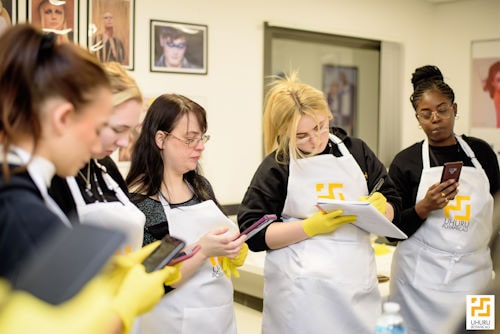 Students learning how to create a skincare brand