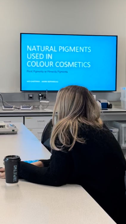 Student learning about natura pigments used in colour cosmetics on a cosmetic formulation training course