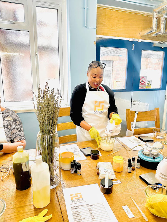 A student mixing the ingredients while learning to fomulate cosmetics