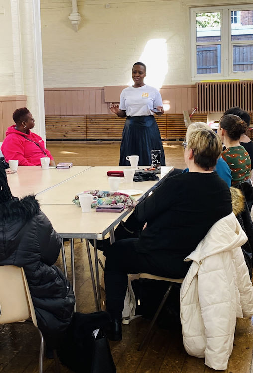 Neo Chatyoka talking to a group about how to create a skincare brand