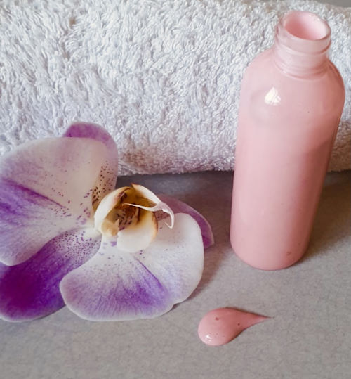 A bottle of pink lotion.